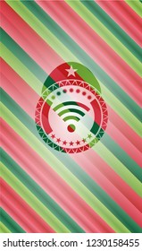 wifi signal icon inside christmas colors emblem.