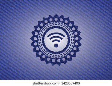 wifi signal icon inside jean or denim emblem or badge background