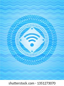 wifi signal icon inside light blue water wave badge background.