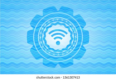 wifi signal icon inside light blue water wave emblem background.