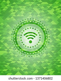 wifi signal icon inside realistic green mosaic emblem