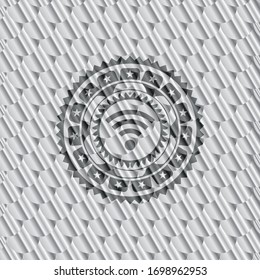 wifi signal icon inside shiny silver badge. Scales pattern. Vector Illustration. Detailed.