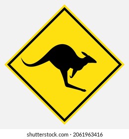 Wild animals (Australian kangaroo black silhouette) ahead vector danger yellow road sign