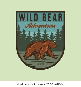 Wild bear adventure camping badge with natural scene