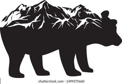 Wild bear (grizzly) and mountains