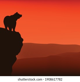 wild bear standing on high cliff at sunset - vector silhouette view of dramatic wilderness scene