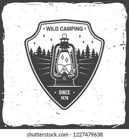 Wild camping. Vector illustration. Concept for shirt or logo, print, stamp or tee. Vintage typography design with camp lantern and forest silhouette. Outdoor adventure symbol
