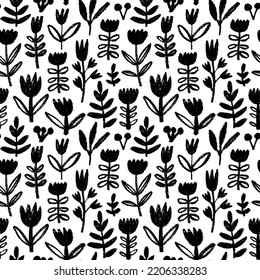 Wild flowers vector seamless pattern. Hand drawn black sketch flowers. Black silhouettes of grass, branches and herbs. Chamomile, clover, daisy simple modern ornament. Charcoal and pencil drawing. 