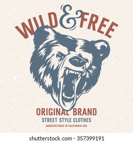 Wild and Free vintage typography with a  head of a grizzly Bear, t-shirt print graphics. Grunge background on separate layer