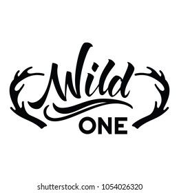 Wild One free hand brush lettering, inspirational quote about freedom. Hand drawn vector typography card with phrase and deer antlers. Bohemian design elements for prints and posters.