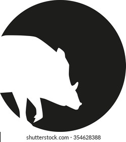 Wild pig silhouette in front of a moon