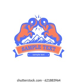 Wild rams fighting with horns on mountain background. Vector logo