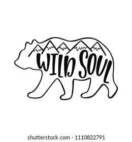 Wild soul. Inspirational quote about bear with mountains silhouette. Hand writing calligraphy phrase. Vector illustration isolated for print and poster. Typography design.