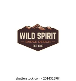 Wild spirit badge emblem patch logo with mountain design and vintage classic style