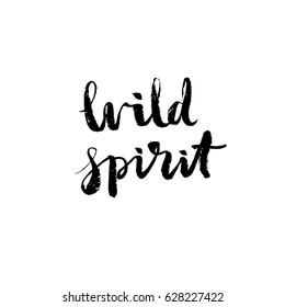 Wild spirit - hand drawn lettering design. Ink black brush painted phrase isolated on white background, photo overlay. Vector illustration.
