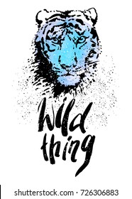 Wild thing lettering. Hand written typography quote. Design for t-shirt, poster, postcard. Tiger head. Hand drawn black and white animal portrait.