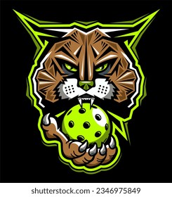 wildcat mascot biting pickleball for school, college or league sports