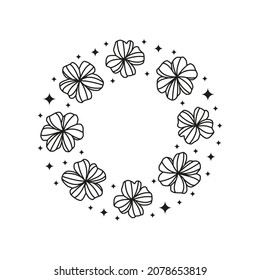 Wildflowers and stars composed in circle shape isolated on white background. Floral boho frame.