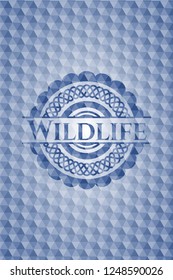 Wildlife blue badge with geometric pattern background.