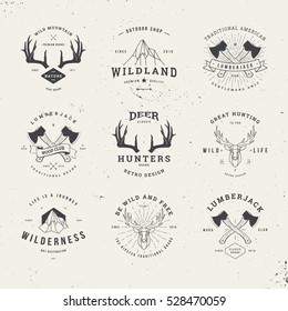 wildlife hunters, hipster logo set with deer antlers, axe and mountains