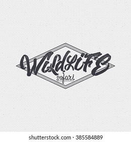 Wildlife safari sign handmade differences, made using calligraphy and lettering It can be used as insignia badge logo design outdoor activities