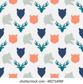 Wildlife seamless pattern. Zoo ornament for print, fabric, cloth, child items and wrap. Nature fauna wallpaper. Silhouettes head animals background. Vector
