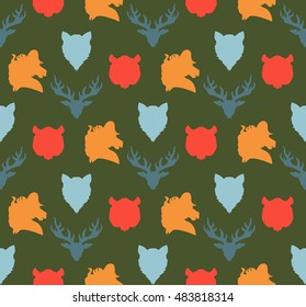 Wildlife seamless pattern. Zoo ornament for print, fabric, cloth, child items and wrap. Nature fauna wallpaper. Silhouettes head animals background. Vector