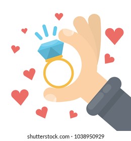 Will you marry me golden ring in hands.