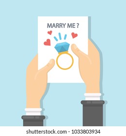 Will you marry me greeting card in hands.
