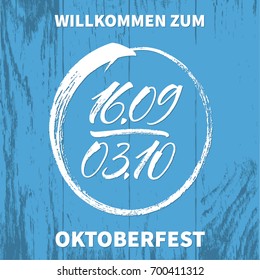 Willkommen zum Oktoberfest (German) / Welcome to Oktoberfest (English) lettering with hand drawn festival dates on blue board texture. Modern calligraphy, vector illustration. 