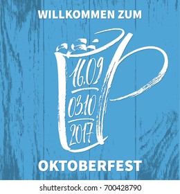 Willkommen zum Oktoberfest (German) / Welcome to Oktoberfest (English) lettering  with hand drawn tankard and festival dates on blue board texture. Modern calligraphy, vector illustration. 