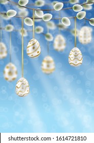 Willow branches with Easter eggs on blue sky with bokeh effect template.