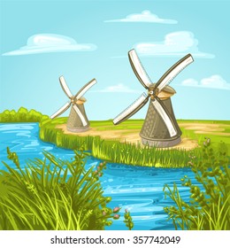 Wind mill near a blue canal on a summer day