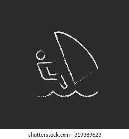Wind surfing hand drawn in chalk on a blackboard vector white icon isolated on a black background.