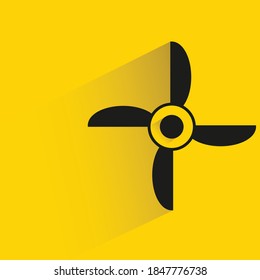 wind turbine with shadow yellow background