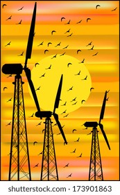 wind turbines at sunset and a flock of birds
