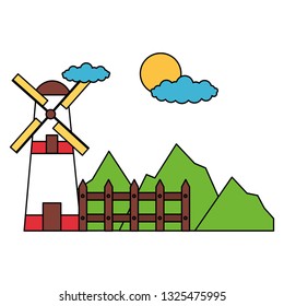 windmill fence mountains sky