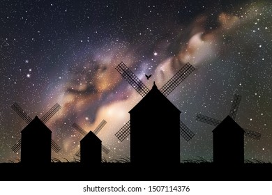 Windmills in field at night. Vector illustration with silhouettes of mills. Summer rural landscape. Space dark background with starry sky and Milky Way