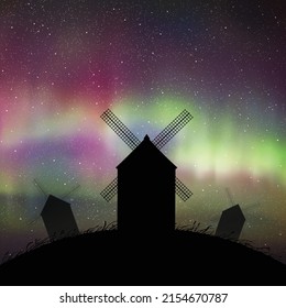 Windmills on hill. Rural landscape. Countryside at night. Polar Lights