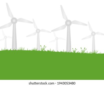 Windmills over a stretch of green pasture