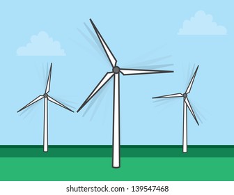 Windmills spinning in a grassy field 