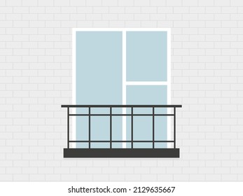 Ventana y balcón contra pared de ladrillo