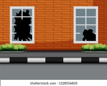 Window with broken glass on red brick wall