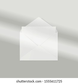 Window frame shadow mockup, natural lightening. Envelope with blank sheet of paper