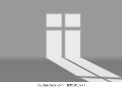 Window light shadow on grey wall background.