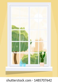 Una ventana que domina la ciudad, llena de sol.