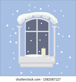 Window in the snow with a candle on a blue background
