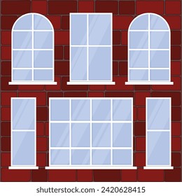 Windows of different shapes on the background of a brick wall