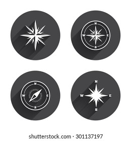 Windrose navigation icons. Compass symbols. Coordinate system sign. Circles buttons with long flat shadow. Vector