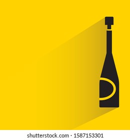 wine bottle with shadow in yellow background